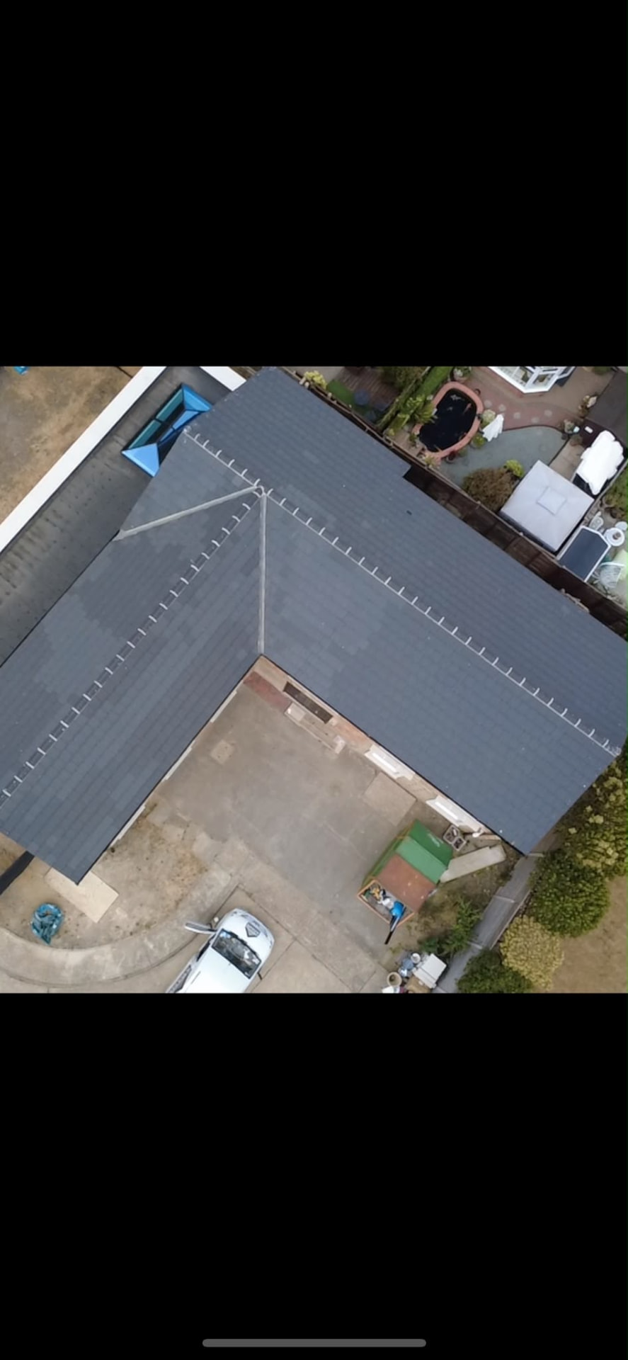 Finished concrete tiled roof with new ridge capping